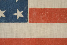 38 STARS IN AN EXTREMELY RARE LINEAL CONFIGURATION WITH 4 TINY STARS EMBEDDED IN THE PATTERN, EITHER MADE BETWEEN 1876-1889 (COLORADO STATEHOOD) OR PERHAPS IN THE 34 STAR PERIOD (1861-63), WITH 4 SMALL STARS FOR THE REMAINING TERRITORIES