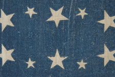 38 STARS IN AN EXTREMELY RARE LINEAL CONFIGURATION WITH 4 TINY STARS EMBEDDED IN THE PATTERN, EITHER MADE BETWEEN 1876-1889 (COLORADO STATEHOOD) OR PERHAPS IN THE 34 STAR PERIOD (1861-63), WITH 4 SMALL STARS FOR THE REMAINING TERRITORIES