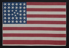 38 STARS IN AN EXTREMELY RARE PATTERN THAT BEARS A CLUSTER OF 6 SMALL STARS WITHIN A LINEAL PATTERN OF LARGER STARS, 1876-1889, COLORADO STATEHOOD