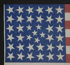 38 STARS IN AN EXTREMELY RARE PATTERN THAT BEARS A CLUSTER OF 6 SMALL STARS WITHIN A LINEAL PATTERN OF LARGER STARS, 1876-1889, COLORADO STATEHOOD