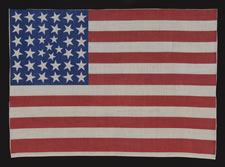 38 STARS IN AN EXTREMELY RARE PATTERN THAT BEARS A CLUSTER OF 6 SMALL STARS WITHIN A LINEAL PATTERN OF LARGER STARS, 1876-1889, COLORADO STATEHOOD
