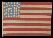 38 STARS IN AN INTERTWINED "DOUBLE-S" CONFIGURATION, ON A CORNFLOWER BLUE CANTON THAT RESTS UPON THE WAR STRIPE, 1876-1889, COLORADO STATEHOOD