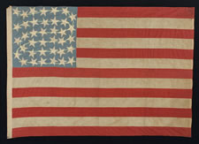 38 STARS IN AN INTERTWINED "DOUBLE-S" CONFIGURATION, ON A CORNFLOWER BLUE CANTON THAT RESTS UPON THE WAR STRIPE, 1876-1889, COLORADO STATEHOOD