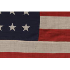38 STARS IN A "NOTCHED" PATTERN ON A 7 ft. CLAMP-DYED AMERICAN FLAG OF THE 1876-1889 PERIOD, REFLECTS COLORADO STATEHOOD, MADE BY THE U.S. BUNTING COMPANY IN LOWELL, MASSACHUSETTS