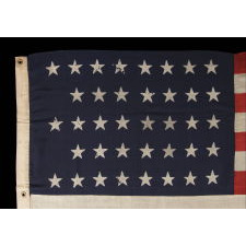 38 STARS IN A "NOTCHED" PATTERN ON A CLAMP-DYED AMERICAN FLAG OF THE 1876-1889 PERIOD, REFLECTS COLORADO STATEHOOD, MADE BY THE U.S. BUNTING COMPANY IN LOWELL, MASSACHUSETTS​