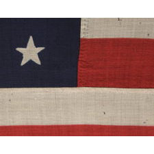 38 STARS IN A "NOTCHED" PATTERN ON A CLAMP-DYED AMERICAN FLAG OF THE 1876-1889 PERIOD, REFLECTS COLORADO STATEHOOD, MADE BY THE U.S. BUNTING COMPANY IN LOWELL, MASSACHUSETTS​