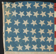 38 STARS POINTING IN VARIOUS DIRECTIONS ON A BRILLIANT, CORNFLOWER BLUE CANTON, COLORADO STATEHOOD, 1876-1889