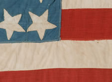 38 STARS POINTING IN VARIOUS DIRECTIONS ON A BRILLIANT, CORNFLOWER BLUE CANTON, COLORADO STATEHOOD, 1876-1889