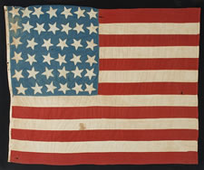 38 STARS POINTING IN VARIOUS DIRECTIONS ON A BRILLIANT, CORNFLOWER BLUE CANTON, COLORADO STATEHOOD, 1876-1889