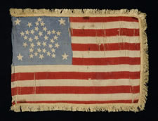 38 STARS IN A RARE GREAT STAR PATTERN, A SILK PARADE FLAG WITH GOLD SILK FRINGE, COLORADO STATEHOOD, 1876-1889