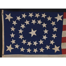 38 STARS IN A RARE OVAL MEDALLION WITH A LARGE CENTER STAR AND FLANKING CORNER STARS, MADE DURING THE PERIOD OF COLORADO STATEHOOD (1876-1889), ATTRIBUTED TO FECHHEIMER BROS. OF CINCINNATI, OHIO