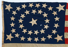 38 STARS IN A RARE OVAL MEDALLION WITH A LARGE CENTER STAR AND FLANKING CORNER STARS, MADE DURING THE PERIOD OF COLORADO STATEHOOD (1876-1889), ATTRIBUTED TO FECHHEIMER BROS. OF CINCINNATI, OHIO