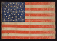 38 STARS IN A TRIPPLE WREATH MEDALLION CONFIGURATION WITH 2 OUTLIERS, A HUGE PARADE FLAG WITH GREAT WEAR, COLORADO STATEHOOD, 1876-1889