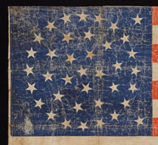 38 STARS IN A TRIPPLE WREATH MEDALLION CONFIGURATION WITH 2 OUTLIERS, A HUGE PARADE FLAG WITH GREAT WEAR, COLORADO STATEHOOD, 1876-1889