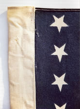 38 STARS, AN UNUSUAL PRINTED FLAG WITH A SEWN COTTON SLEEVE, COLORADO STATEHOOD
