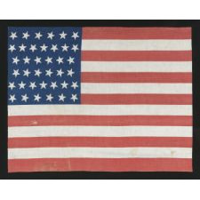 38 STARS WITH VARYING ORIENTATIONS ON AN ANTIQUE AMERICAN FLAG WITH "SQUARISH" PROPORTIONS, A LARGE AND EXTREMELY SCARCE EXAMPLE, 1876-1889, COLORADO STATEHOOD