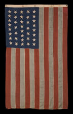38 TILTING STARS IN A LINEAL PATTERN, MADE BY HORSTMANN BROTHERS, PHILADELPHIA, 1876-1889, COLORADO STATEHOOD