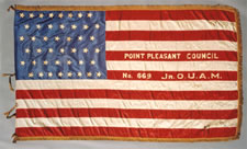 44 STAR ANTIQUE AMERICAN FLAG, MADE OF SILK, WITH GILT-PAINTED STARS & LETTERS THAT DESIGNATE A CHAPTER OF THE JUNIOR ORDER OF UNITED AMERICAN MECHANICS, A PATRIOTIC FRATERNAL ORGANIZATION FOUNDED IN PHILADELPHIA, PENNSYLVANIA IN 1853; MADE DURING THE PERIOD WHEN WYOMING WAS THE MOST RECENT STATE TO JOIN THE UNION, circa 1890-1896