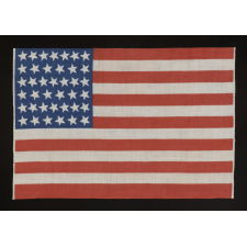 39 CANTED STARS ON A TALL AND NARROW, ROYAL BLUE CANTON, AN 1876 VARIETY REPRESENTING THE ANTICIPATION OF THE ADDITION OF THE DAKOTA AND COLORADO TERRITORIES, NEVER ACCURATE OR OFFICIAL