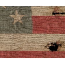 39 TUMBLING STARS IN STAGGERED ROWS ON AN ANTIQUE AMERICAN FLAG WITH A GHOSTLY PRESENTATION FROM EXTENSIVE WEAR, MADE DURING THE ERA OF THE 1876 CENTENNIAL OF AMERICAN INDEPENDENCE, NEVER AN OFFICIAL STAR COUNT, REFLECTS THE ANTICIPATED ARRIVAL OF THE DAKOTA TERRITORY AS A SINGLE STATE