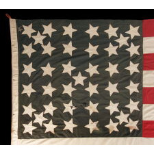 41 STARS IN A LINEAL PATTERN WITH OFFSET STARS THAT CREATE A CROSSHATCH IN THE CORNERS AND CENTER, ONE OF THE RAREST STAR COUNTS AMONG SURVIVING FLAGS OF THE 19TH CENTURY, REFLECTS MONTANA STATEHOOD IN NOVEMBER, 1889, ACCURATE FOR JUST 3 DAYS; EXHIBITED AT THE MUSEUM OF THE AMERICAN REVOLUTION FROM JUNE – SEPTEMBER, 2021