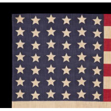 42 STARS ON AN ANTIQUE AMERICAN FLAG WITH A WAVE CONFIGURATION OF LINEAL COLUMNS, AN UNOFFICIAL STAR COUNT THAT REFLECTS THE ADDITION OF WASHINGTON STATE, MONTANA, AND THE DAKOTAS, circa 1889-1890