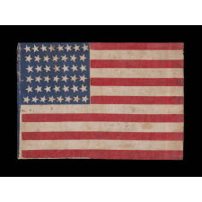 44 STAR ANTIQUE AMERICAN FLAG WITH AN HOURGLASS FORMATION ON A BRILLIANT BLUE CANTON; REFLECTS THE ERA WHEN WYOMING WAS THE MOST RECENT STATE TO JOIN THE UNION, 1890-1896