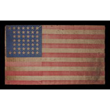 44 STAR ANTIQUE AMERICAN PARADE FLAG WITH A CORNFLOWER BLUE CANTON, ITS STARS ARRANGED IN A NOTCHED PATTERN, AND WITH A KEENLY ENDEARING PRESENTATION, 1890-1896, WYOMING STATEHOOD