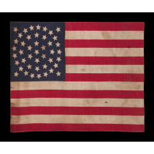 44 STAR ANTIQUE AMERICAN PARADE FLAG WITH A TRIPLE WREATH FORM OF THE MEDALLION CONFIGURATION, RARE IN THIS PERIOD WITH A CIRCULAR STAR ARRANGEMENT, 1890-1896, REFLECTS THE ADDITION OF WYOMING TO THE UNION