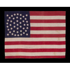 44 STAR ANTIQUE AMERICAN PARADE FLAG WITH A TRIPLE WREATH FORM OF THE MEDALLION CONFIGURATION, RARE IN THIS PERIOD WITH A CIRCULAR STAR ARRANGEMENT, 1890-1896, REFLECTS THE ADDITION OF WYOMING TO THE UNION