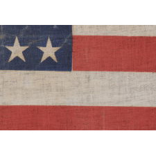 44 STARS IN A NOTCHED PATTERN ON A LARGE AMERICAN PARADE FLAG WITH A PENCILED INSCRIPTION FROM A CELEBRATION OF JULY 4TH IN NORTH DAKOTA, 1890-1896, REFLECTS WYOMING STATEHOOD, EX-RICHARD PIERCE COLLECTION