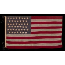 45 STAR ANTIQUE AMERICAN FLAG WITH STAGGERED ROWS OF STARS ON A DUSTY BLUE CANTON; REFLECTS THE PERIOD WHEN UTAH WAS THE MOST RECENT STATE TO JOIN THE UNION, 1896-1908