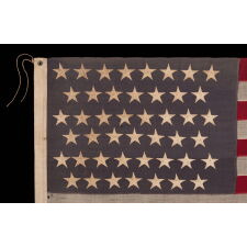 45 STAR ANTIQUE AMERICAN FLAG WITH STAGGERED ROWS OF STARS ON A DUSTY BLUE CANTON; REFLECTS THE PERIOD WHEN UTAH WAS THE MOST RECENT STATE TO JOIN THE UNION, 1896-1908