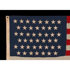45 STAR ANTIQUE AMERICAN FLAG IN A SMALL AND DESIRABLE SCALE AMONG THOSE OF THE PERIOD WITH PIECED AND SEWN CONSTRUCTION, OFFICIAL FROM 1896-1908; MARKED ‘STANDARD”; SPANISH-AMERICAN WAR ERA, REFLECTS THE PERIOD WHEN UTAH WAS THE MOST RECENT STATE TO JOIN THE UNION