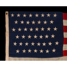 45 STAR ANTIQUE AMERICAN FLAG IN A SMALL AND DESIRABLE SCALE AMONG THOSE OF THE PERIOD WITH PIECED AND SEWN CONSTRUCTION, OFFICIAL FROM 1896-1908; SPANISH-AMERICAN WAR ERA, REFLECTS THE PERIOD WHEN UTAH WAS THE MOST RECENT STATE TO JOIN THE UNION
