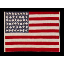 46 STAR ANTIQUE AMERICAN FLAG WITH VARIED STAR POSITIONING, A SCARCE AND BEAUTIFUL EXAMPLE; REFLECTS THE PERIOD WHEN OKLAHOMA WAS THE MOST RECENT STATE TO JOIN THE UNION, circa 1907-1912