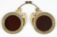 FIGURAL OPTOMETRIST TRADE SIGN, DIMINUTIVE SIZE, GILDED METAL AND HAND-BLOWN, COLORED GLASS