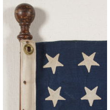 48 STAR JACK ON THE ORIGINAL TURNED HARDWOOD STAFF OF A CHRIS CRAFT, 1930-1955