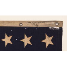 48 STAR U.S. NAVY JACK, MARKED AS HAVING BEEN FLOWN ON THE U.S.S. FT. MANDAN, LAUNCHED NEAR THE END OF WWII, IN 1945, WITH SERVICE DURING BOTH THE KOREAN AND VIETNAM WAR ERAS, IN THE ARCTIC, AT THE NORTH POLE, AND AT GUANTANAMO BAY DURING THE CUBAN MISSILE CRISIS; FLOWN DURING THE EARLIEST POINT OF THE SHIP’S SERVICE, THE FLAG EXHIBITS ENDEARING WEAR FROM OBVIOUS USE