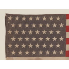 48 STAR VINTAGE AMERICAN FLAG WITH "VICTORY AT WAKE ISLAND" AND "U.S. MARINE CORPS" OVERPRINTS, MADE TO CELEBRATE THE TRIUMPHANT DEFENSE OF THIS REMOTE AMERICAN BASE AGAINST REPEATED JAPANESE ATTACKS IN 1941, AT THE OUTSET OF WWII