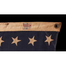 48 STAR, VINTAGE AMERICAN FLAG WITH AN EARLY “STORM KING” LABEL, ATTRIBUTED TO THE “OLD GLORY” FLAG CO. OF CHICAGO, OR COLLEGEVILLE FLAG & MFG. CO. OF PENNSYLVANIA, circa 1935-1950