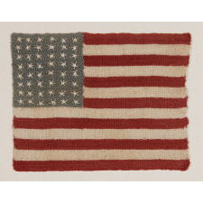 48 STARFISH-LIKE, NEEDLEWORK EXECUTED STARS ON A HAND-CROCHETED ANTIQUE AMERICAN FLAG FROM THE EARLIEST PART OF THE 48 STAR ERA, 1912-WWI (U.S. INVOLVEMENT 1917-18) OR EVEN PRIOR TO THE RESPECTIOVCE STATES’ ADDITION; AN EXCEPTIONAL LITTLE EXAMPLE OF THE HIGHEST ORDER