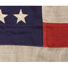 48 STARS IN STAGGERED ROWS ON AN ANTIQUE AMERICAN FLAG MADE BETWEEN 1912 AND 1918, OR PERHAPS PRIOR; REFLECTS ARIZONA & NEW MEXICO STATEHOOD