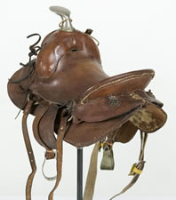 REMARKABLE SET OF SALESMAN'S SAMPLE HORSE SADDLES AND COLLARS, WITH ACCOMPANYING ITEMS, CA 1890-1920