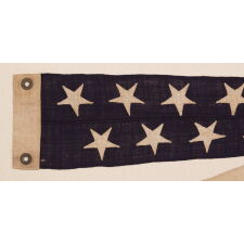 6-FOOT SHIP’S COMMISSION PENNANT WITH A 5.5” HOIST AND 13 STARS IN 2 STAGGERED ROWS, LIKELY PRODUCED FOR A PRIVATE VESSEL, circa 1892-1910