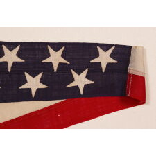 6-FOOT SHIP’S COMMISSION PENNANT WITH A 5.5” HOIST AND 13 STARS IN 2 STAGGERED ROWS, LIKELY PRODUCED FOR A PRIVATE VESSEL, circa 1892-1910