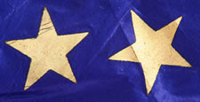 38 STAR FLAG WITH GILT-PAINTED STARS IN A MEDALLION CONFIGURATION, AN INDIAN WARS ERA BATTLE FLAG, 1876-1889, COLORADO STATEHOOD, HAND-SEWN SILK WITH GOLD FRINGE