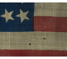 38 STARS, COLORADO STATEHOOD, A PRESS-DYED WOOL FLAG MADE FOR THE 1876 CENTENNIAL INTERNATIONAL EXPOSITION IN PHILADELPHIA AND SOLD BY HORSTMANN BROTHERS