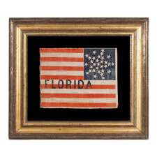 31 STAR ANTIQUE AMERICAN FLAG WITH A RARE VARIATION OF THE “GREAT STAR” PATTERN AND "FLORIDA" PAINTED IN THE STRIPED FIELD, PART OF A GROUP OF EXAMPLES REPRESENTING BOTH STATES & TERRITORIES, MADE TO MARK THE SEATS WHERE THE RESPECTIVE DELEGATES SAT AT THE 1860 REPUBLICAN NATIONAL “WIGWAM” CONVENTION IN CHICAGO, WHERE LINCOLN WAS SELECTED FROM THE 3RD BALLOT TO BECOME THE REPUBLICAN PARTY’S FIRST EVER SUCCESSFUL PRESIDENTIAL CANDIDATE; FOUND IN MIDDLETOWN, NY AMONG THE EFFECTS OF WHIG 
