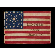 ANTIQUE AMERICAN FLAG MADE FOR THE 1860 PRESIDENTIAL CAMPAIGN OF ABRAHAM LINCOLN & HANNIBAL HAMLIN, WITH 31 STARS IN A FANCIFUL STARBURST OR ‘GREAT STAR-IN-A-SQUARE’ MEDALLION; ONE OF THE RAREST AND MOST GRAPHIC OF ALL CONFIGURATIONS THAT HAVE BEEN IDENTIFIED IN 19TH CENTURY EXAMPLES; THE ONLY KNOWN LINCOLN CAMPAIGN FLAG IN THIS STYLE, AND ONE OF JUST 3 PARADE FLAGS OF ANY SORT THAT SHARE THIS SPECTACULAR STAR ARRANGEMENT